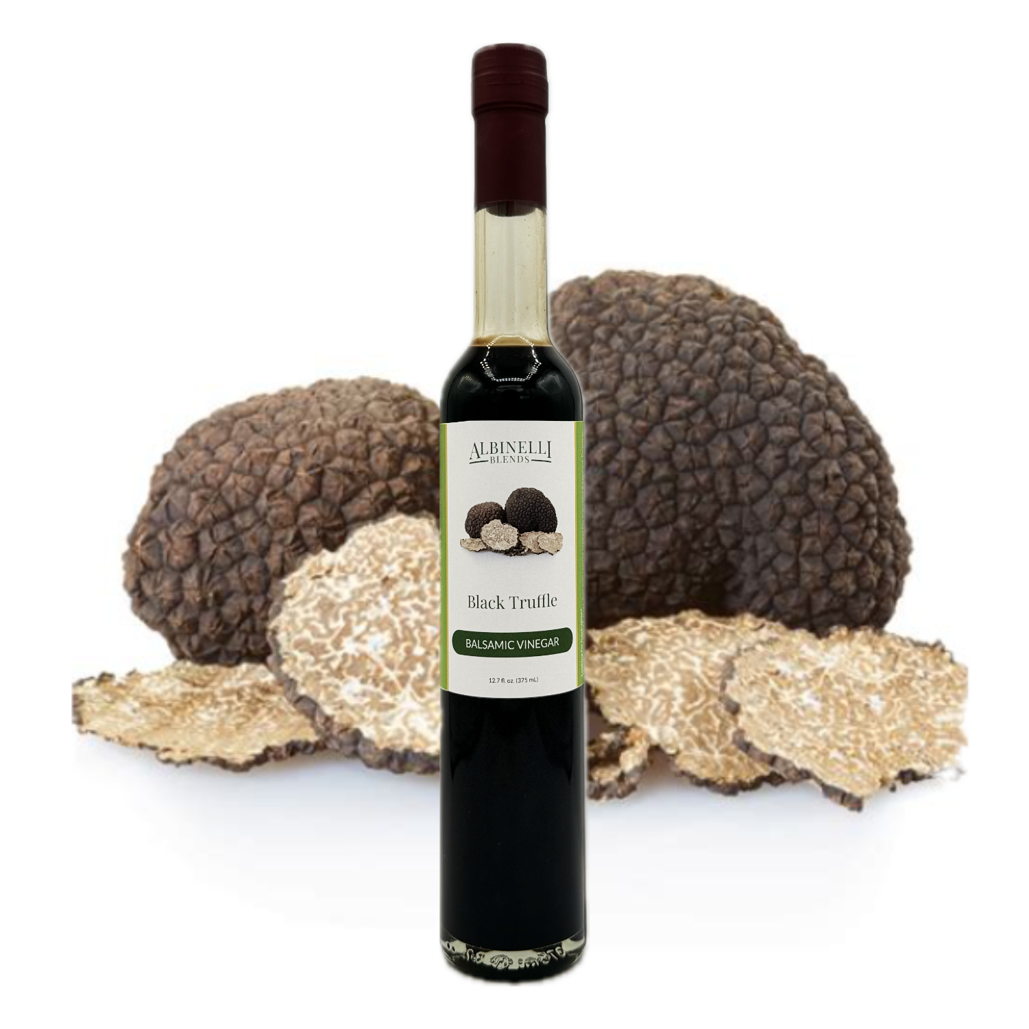 a bottle of balsamic with a cluster of black truffles