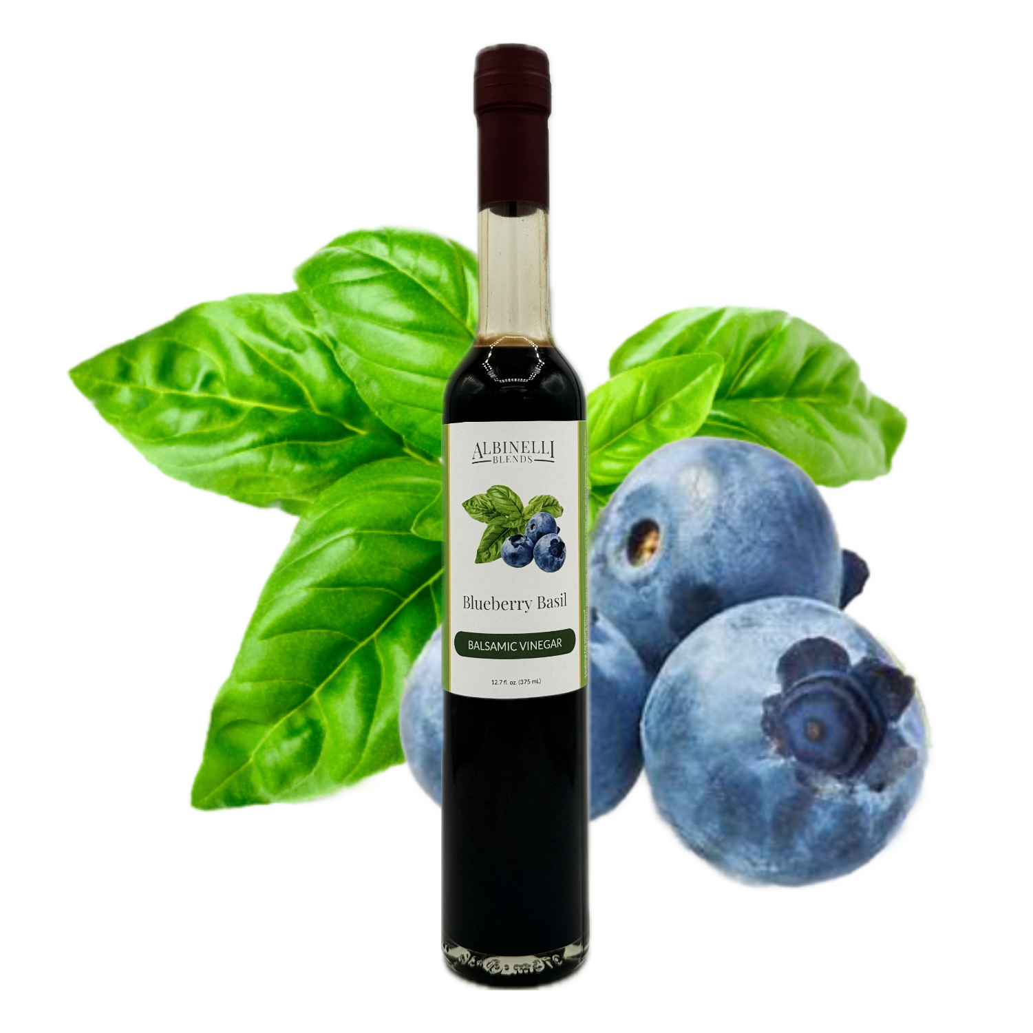 a bottle of balsamic vinegar in front of basil and blueberry